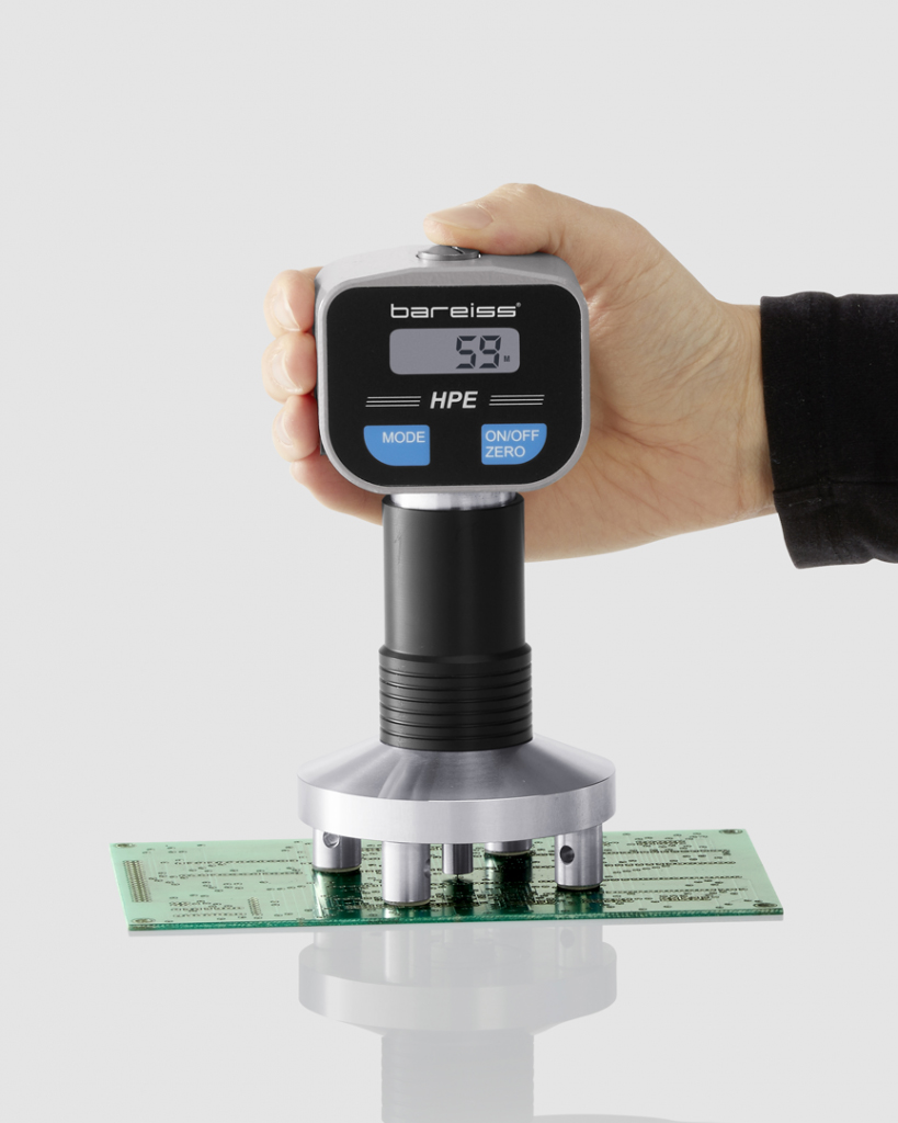 Digital handheld hardness tester Barcol with sample